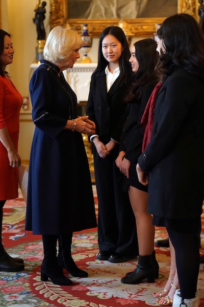The Queen Consort meeting guests during a reception for winners of the Queen's Commonwealth Essay Competition, at Buckingham Palace in London. Picture date: Thursday November 17, 2022.